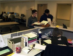 Students standing at the Writing Center reception desk in Thaw Hall.