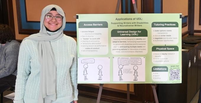 Student standing beside a poster titled Applications of UDL in the Writing Center